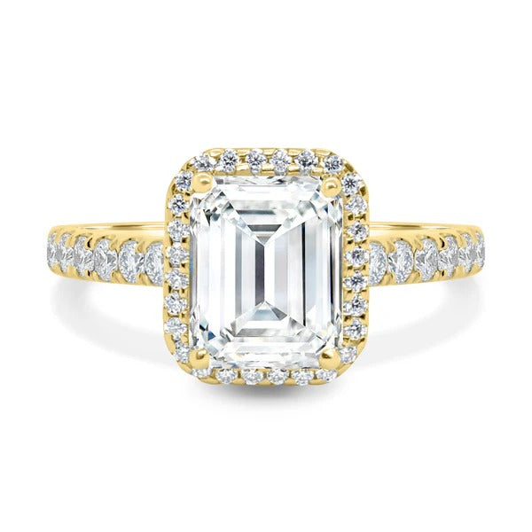 Emerald cut lab grown diamond halo ring with pave shoulders