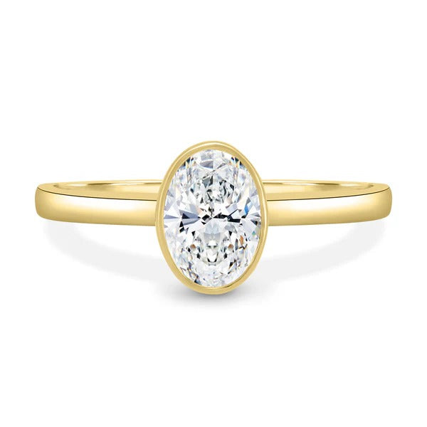 Oval cut lab grown diamond low profile full bezel ring on a flat band
