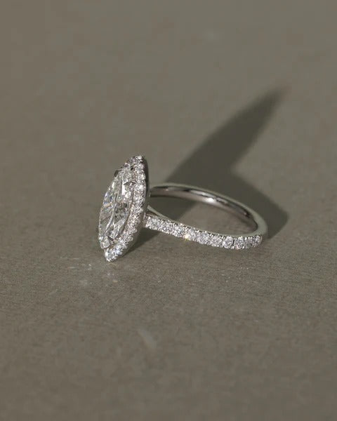 Marquise shaped halo tapering to a point at each end of the stone