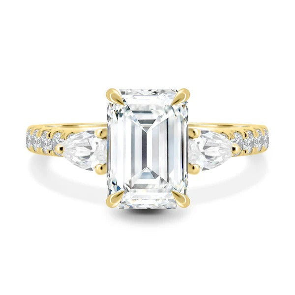 Emerald cut lab grown diamond three stone ring with pear sides and pave