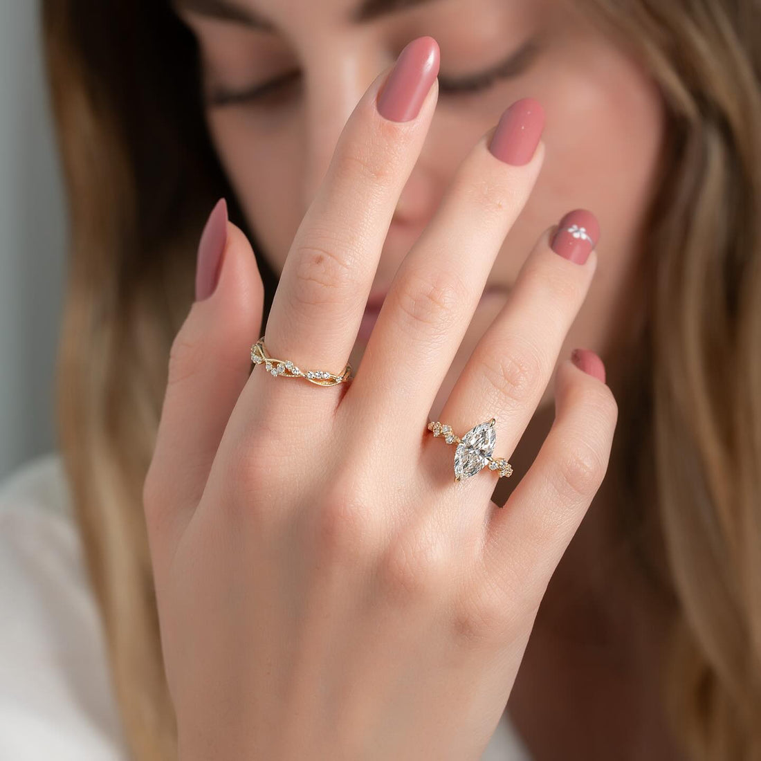 Marquise cut lab grown diamond ring with diamond cluster shoulders in yellow gold