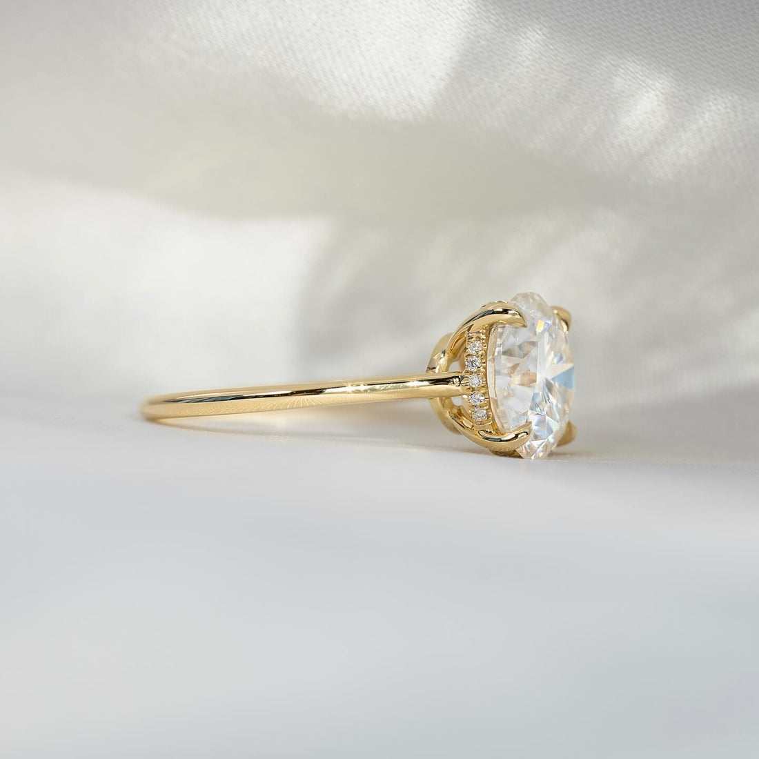 Round brilliant lab grown diamond ring in yellow gold with a pave set gallery post seen in profile