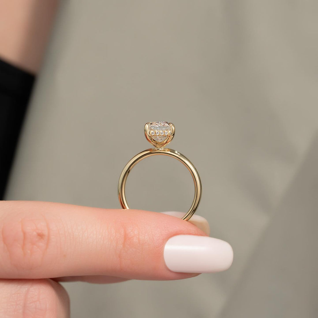 Elongated radiant cut lab grown diamond hidden halo ring on a comfort fit yellow gold band