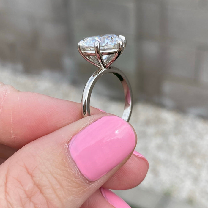 Round brilliant lab grown diamond antique Art Deco engagement ring, angled view