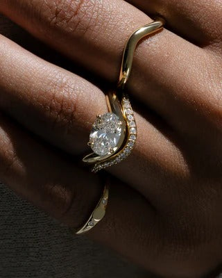 Oval cut lab grown diamond east west ring on sculptural twist band