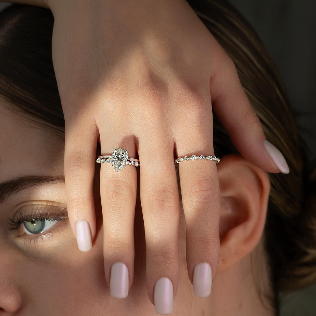 Pear cut lab grown diamond ring with dotted accent line shoulders in white gold