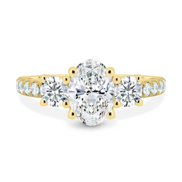 Oval cut lab grown diamond three stone ring with round sides and pave