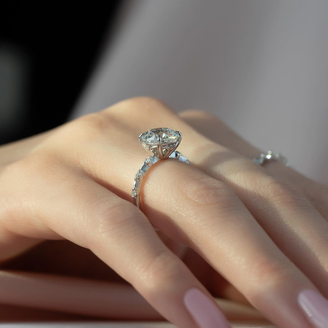 Round brilliant cut lab grown diamond ring on a graduated diamond shank in white gold