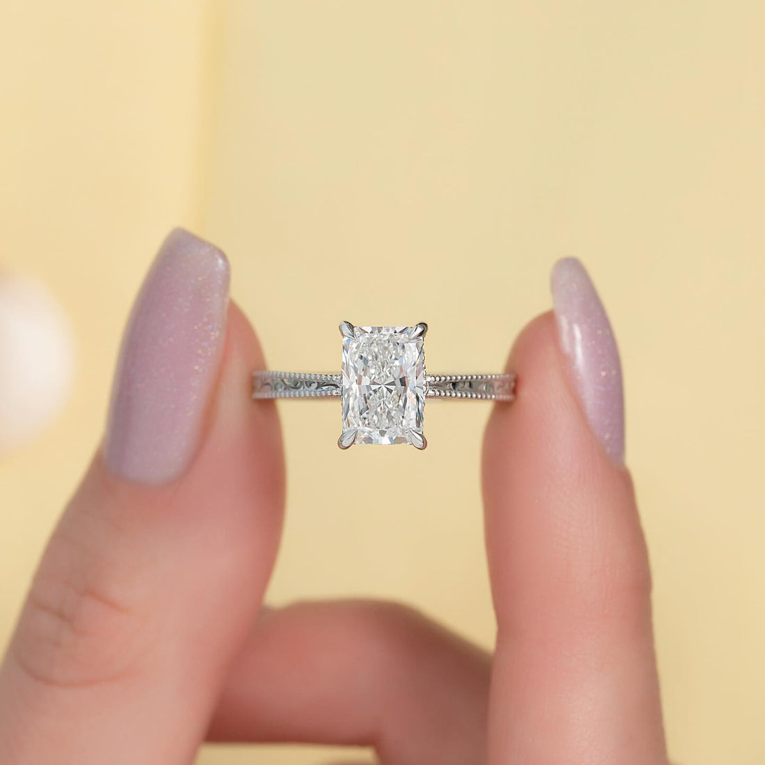 Radiant cut lab grown diamond vintage ring on a filigree pave band in white gold, front view