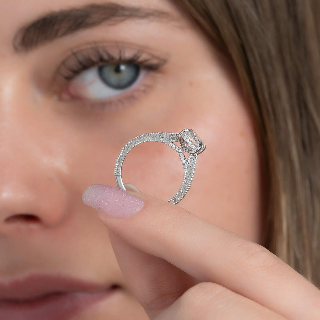 Elongated radiant cut lab grown diamond ring with scroll filigree shank in white gold