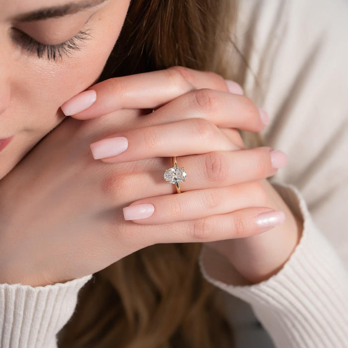 Oval lab grown diamond engagement ring on a tapered plain shank