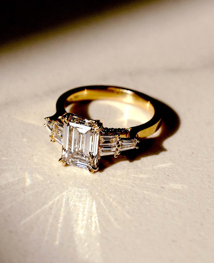 2.5 CT emerald cut moissanite engagement ring in 14K gold