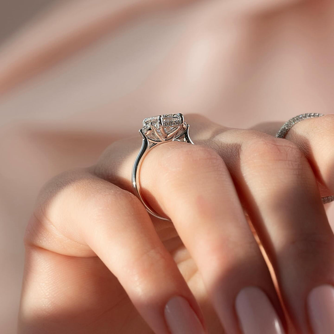 Emerald cut moissanite side cluster ring side profile in white gold