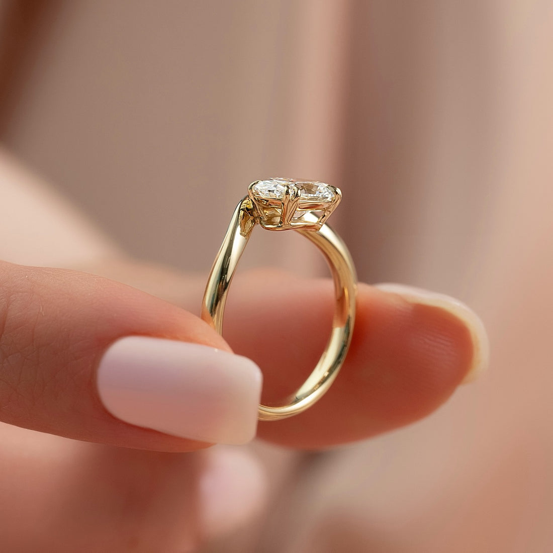 Oval moissanite east west bypass solitaire ring profile in yellow gold