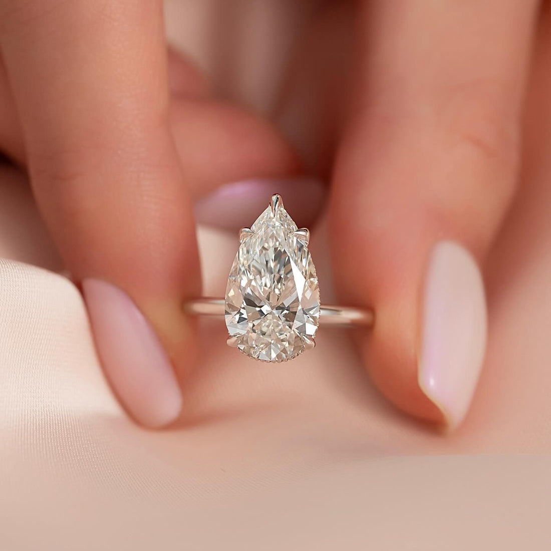Pear moissanite hidden halo solitaire ring on thin white gold band