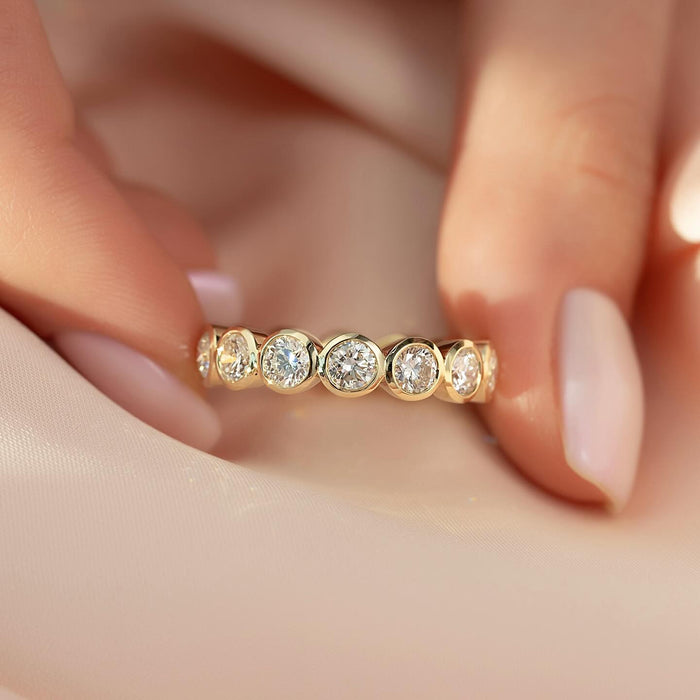 Round Moissanite Bezel Set Eternity Wedding Band in 14K Gold