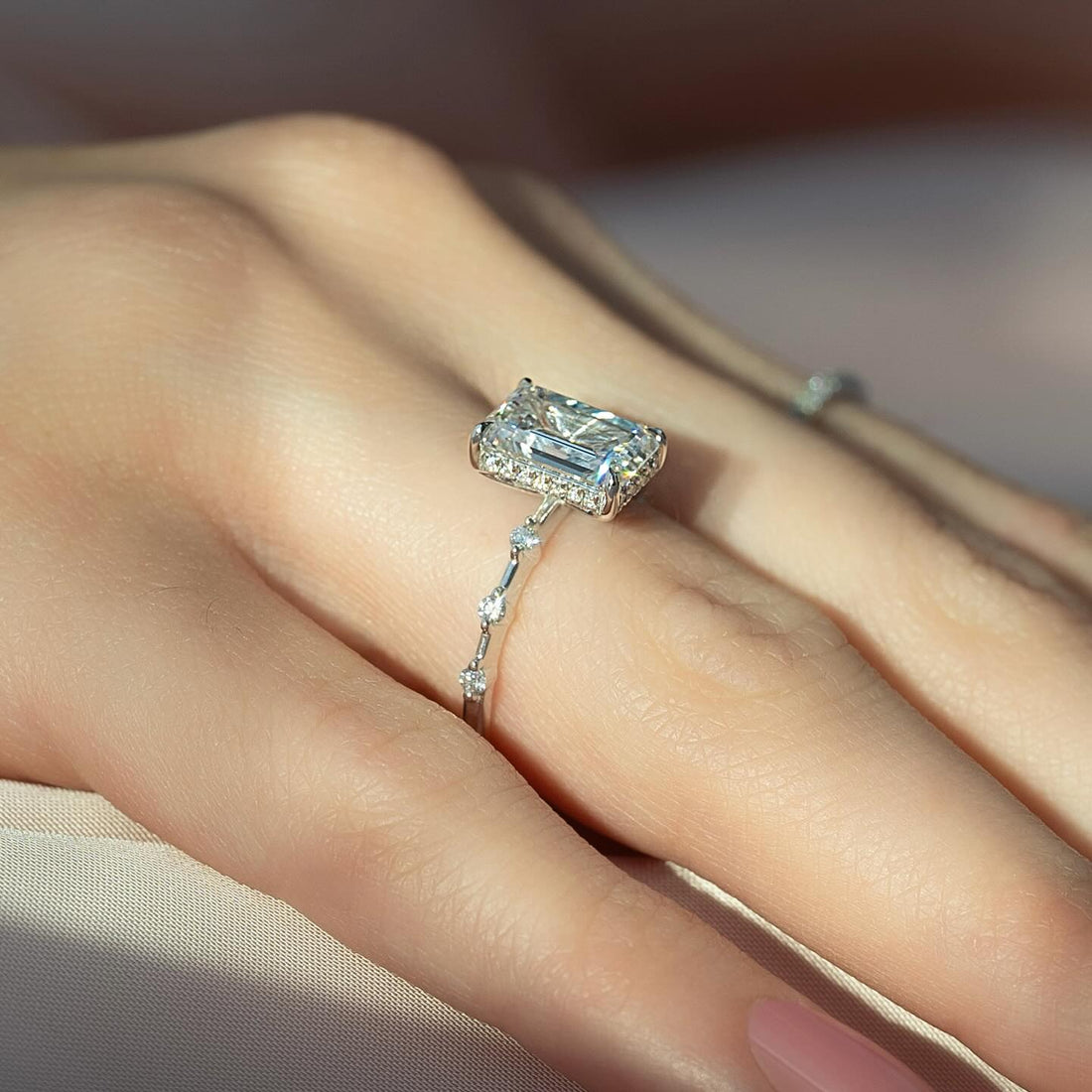 Emerald Cut Moissanite Hidden Halo Marquise Accent Ring in 14K Gold on hand