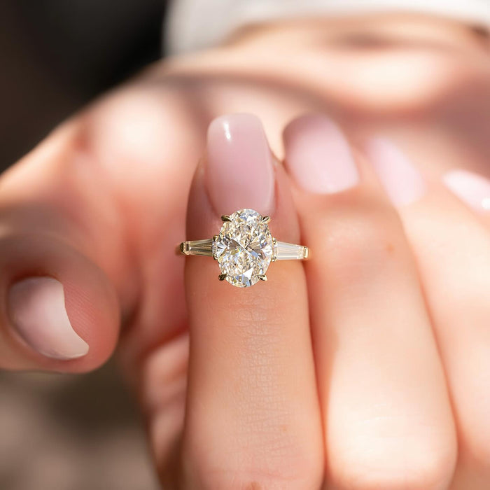 Oval Moissanite Three Stone Tapered Baguette Ring in 14K Gold