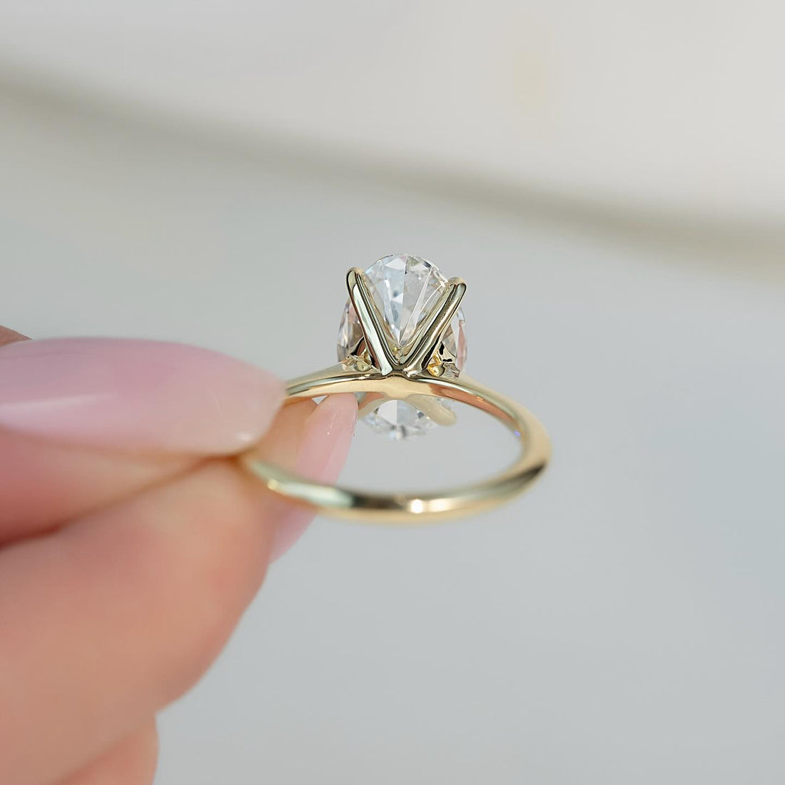 Oval Moissanite East West Thin Band Solitaire Ring profile in 14K Gold