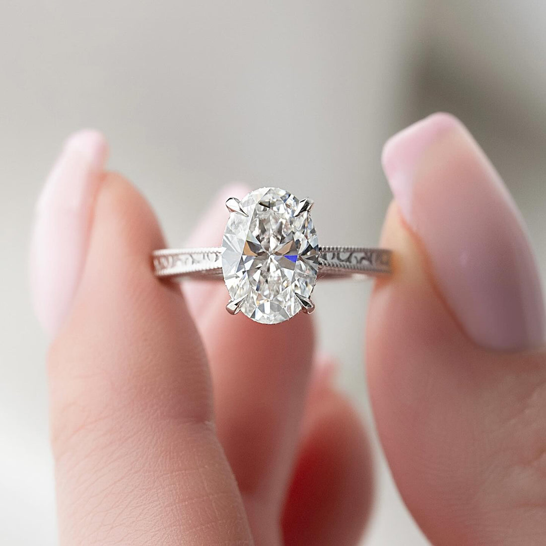 Oval Moissanite Filigree Engraved Band Solitaire Ring in 14K Gold