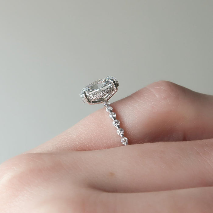 Oval Moissanite Hidden Halo Shared Prong Accent Ring in 14K Gold
