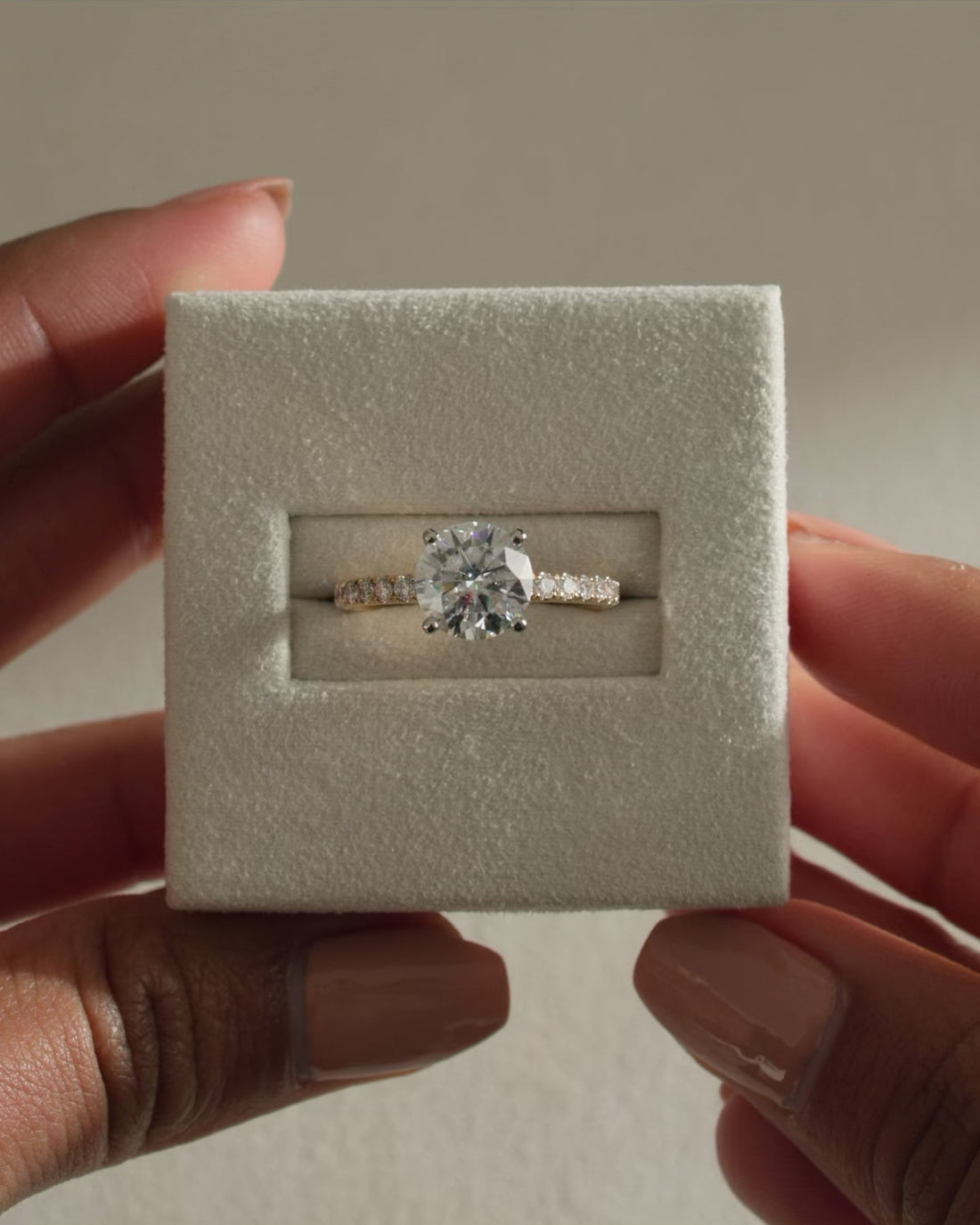 Round Cut Moissanite Four Claw Engagement Ring with Graduated Pave Band - view 1