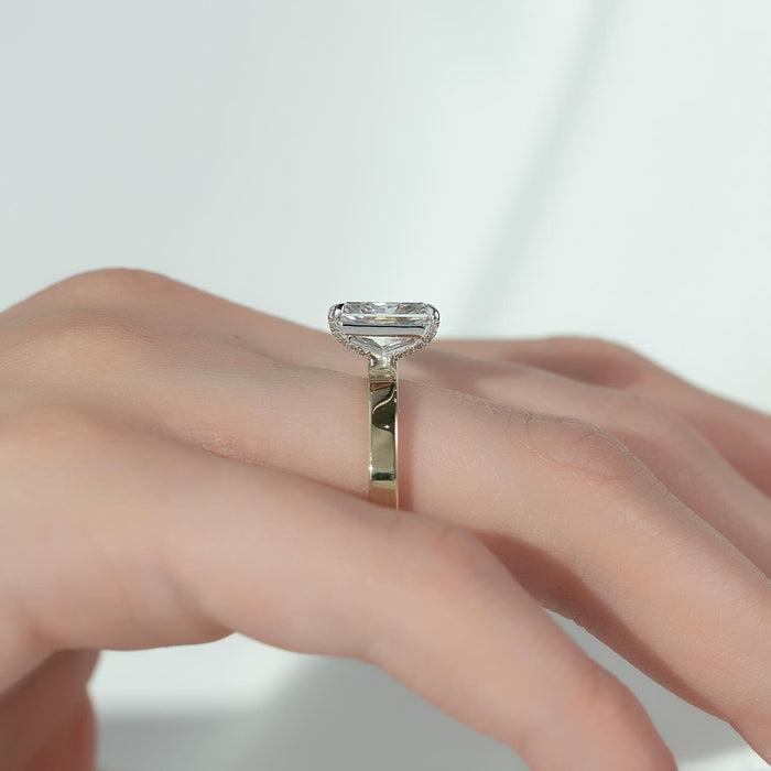 Radiant cut moissanite hidden halo flat band ring side view showing hidden halo