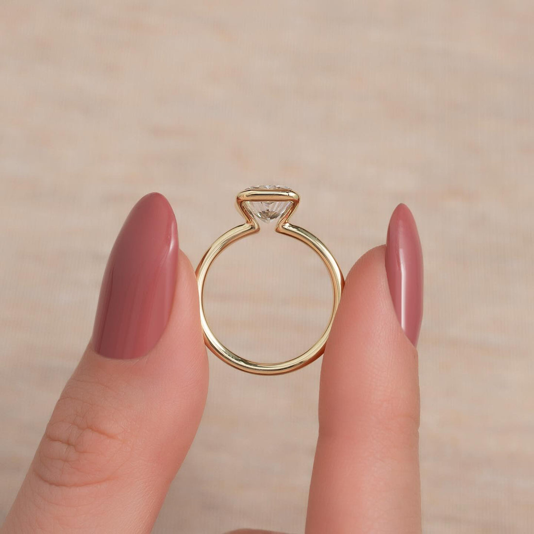 Radiant cut moissanite half bezel solitaire ring side profile in 14K yellow gold