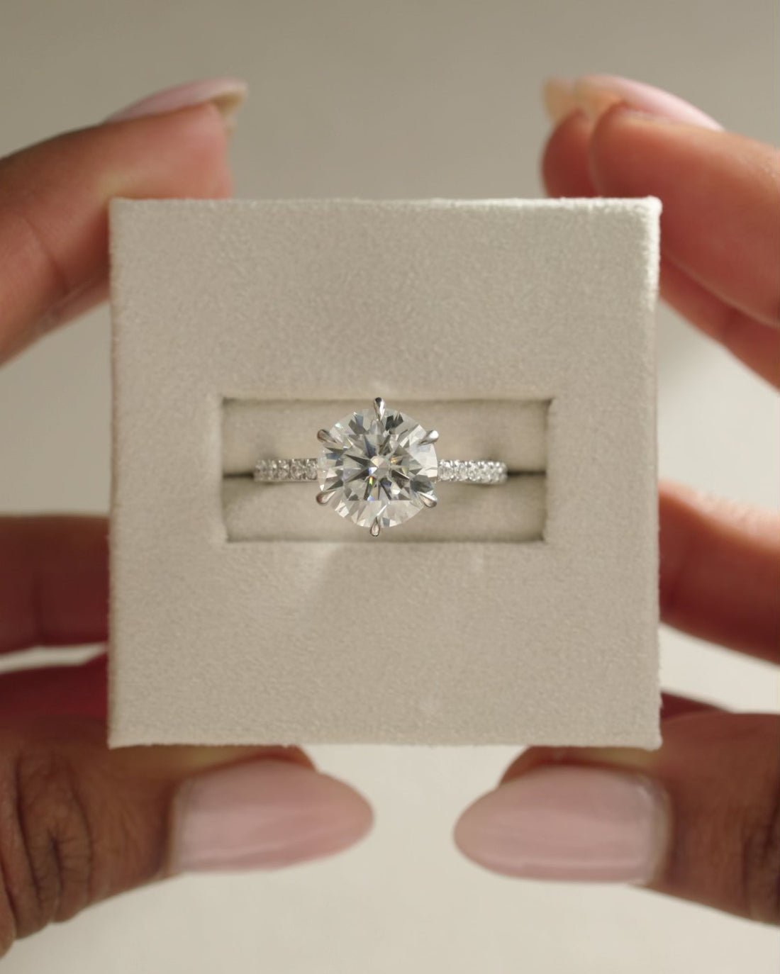 Round Cut Moissanite Hidden Halo Engagement Ring with Six Claws and Pave Band - view 1