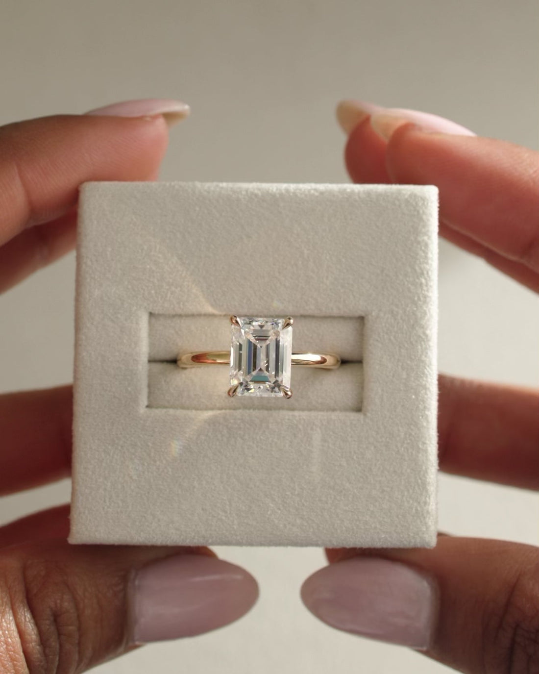 Emerald Cut Moissanite Hidden Halo Solitaire Engagement Ring with Thin Polished Band - view 1