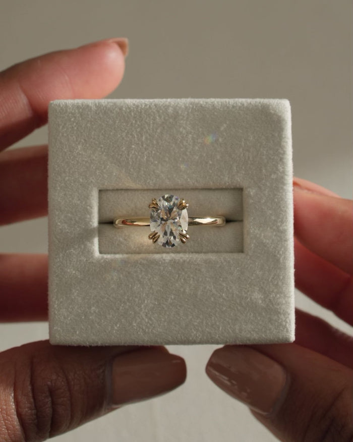 Oval Cut Moissanite Double Claw Solitaire Engagement Ring with Slim Polished Band - view 1