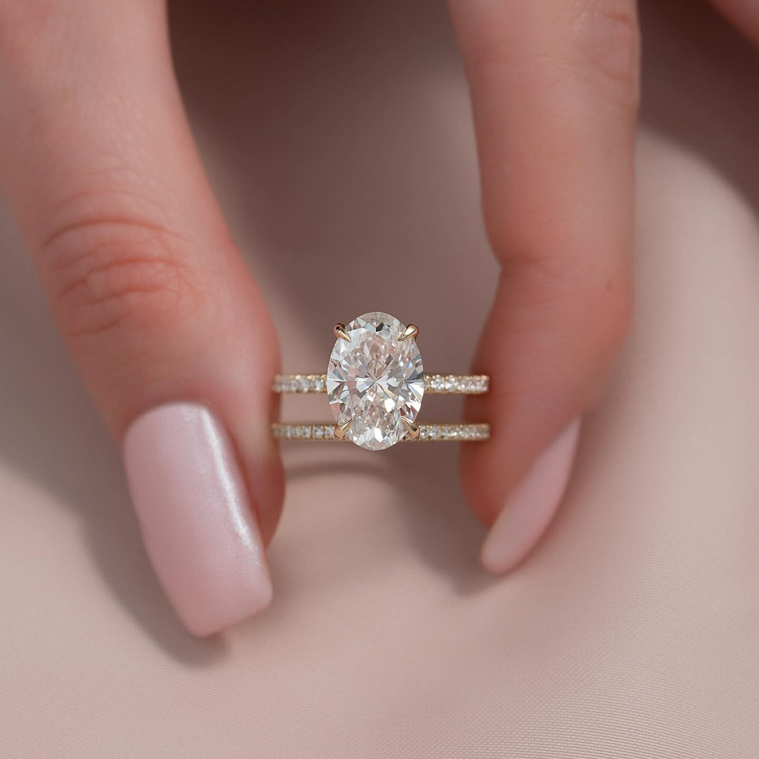 Oval cut moissanite hidden halo pave solitaire ring in 14K yellow gold