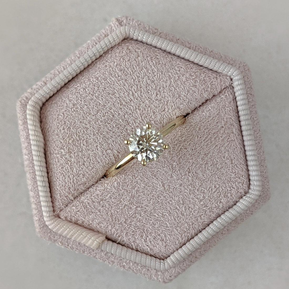 Round cut lab grown diamond hidden halo solitaire ring in yellow gold