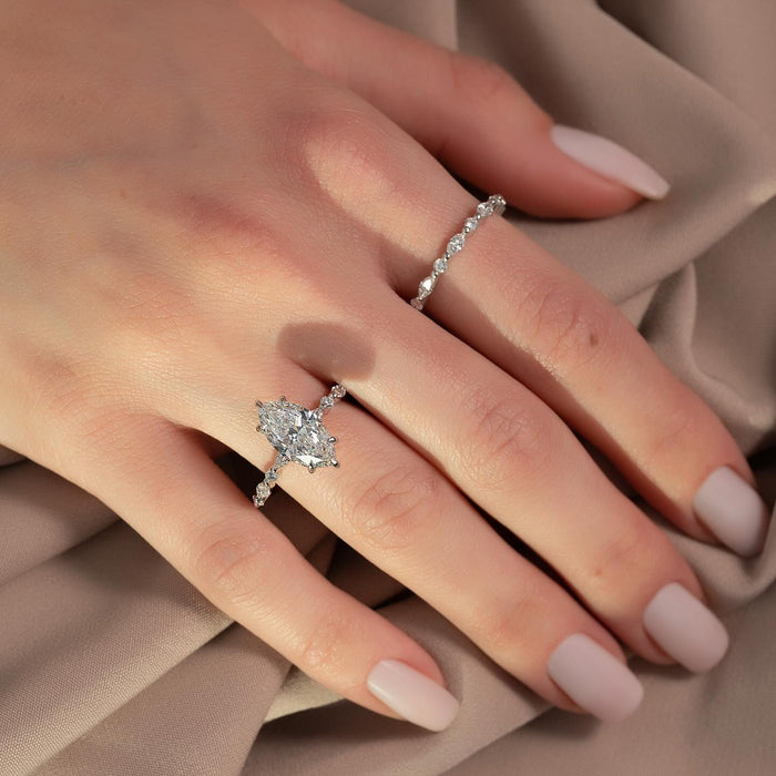 Marquise cut moissanite hidden halo accent band ring in 14K white gold on hand