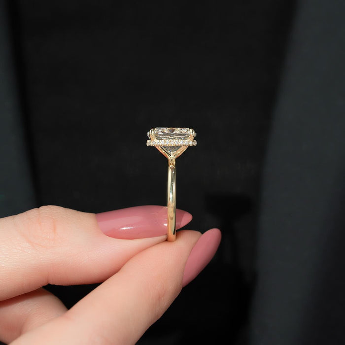 Elongated cushion moissanite hidden halo solitaire ring side profile in 14K yellow gold