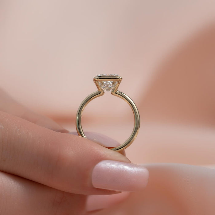 Princess cut moissanite half bezel thin band ring side profile in 14K yellow gold