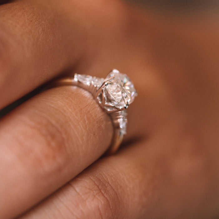 Oval Cut Moissanite Three Stone Pear Accent Engagement Ring - front view 2