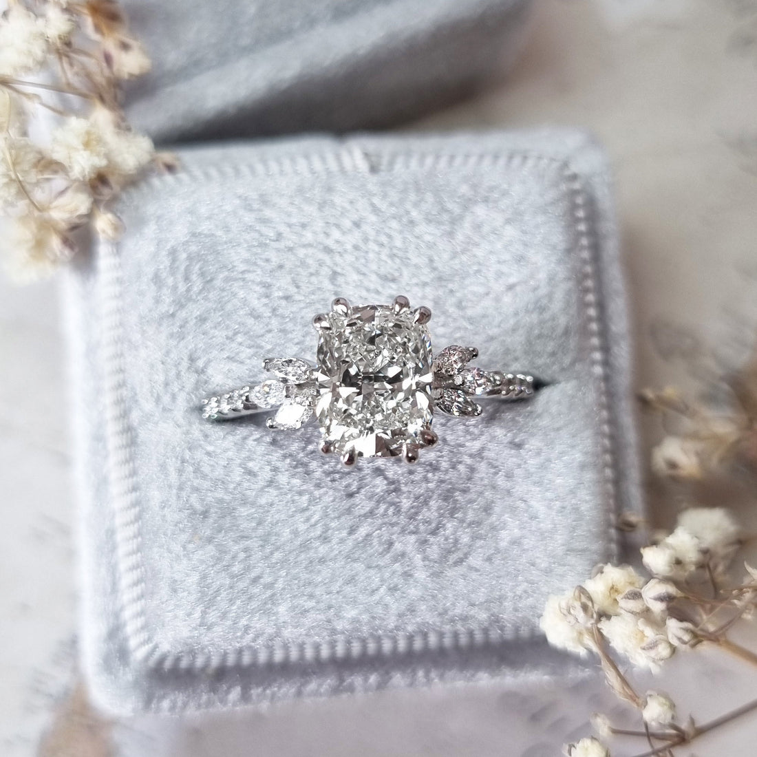 Cushion cut lab grown diamond ring with marquise cluster shoulders in white metal