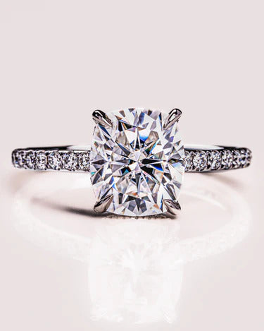 Cushion cut moissanite engagement ring with hidden halo in gold
