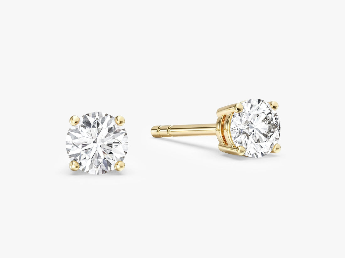 Pair of classic round moissanite basket stud earrings in yellow gold