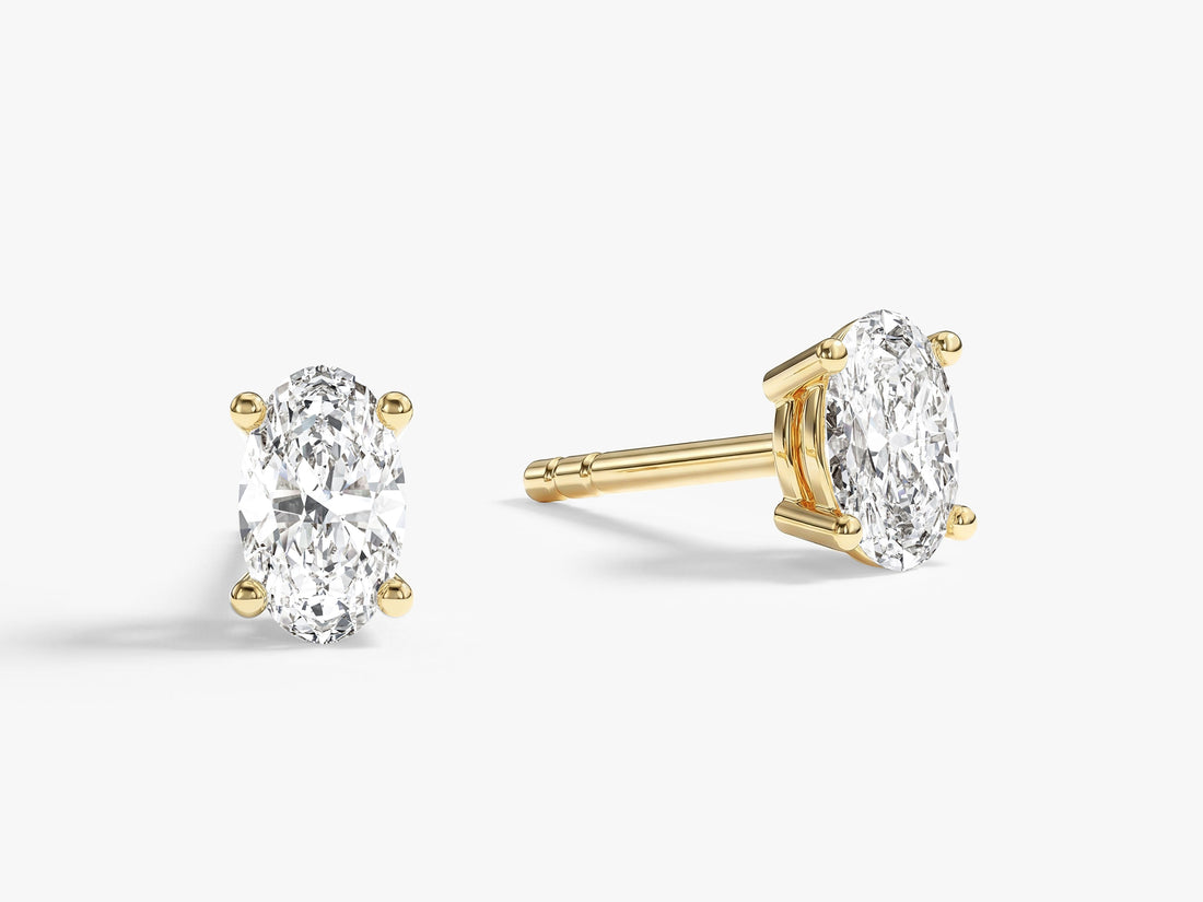 Pair of classic oval moissanite stud earrings for women in yellow gold