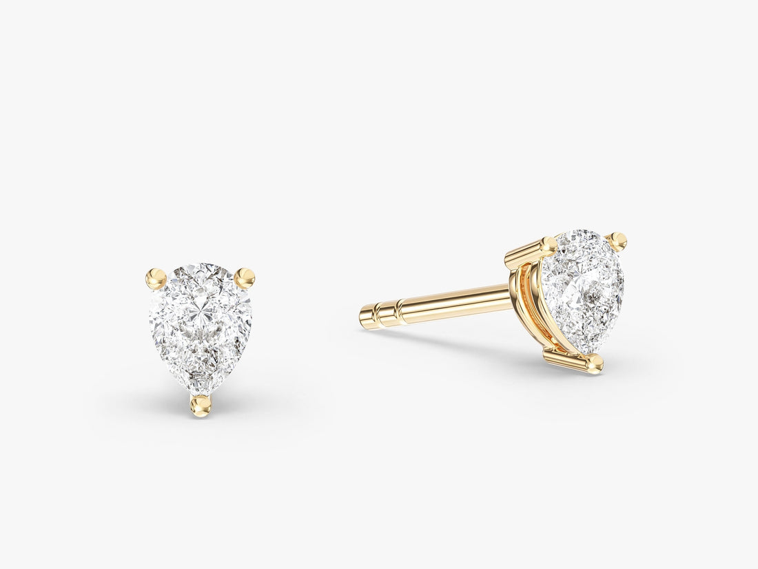 Pair of teardrop pear moissanite solitaire studs for women in yellow gold