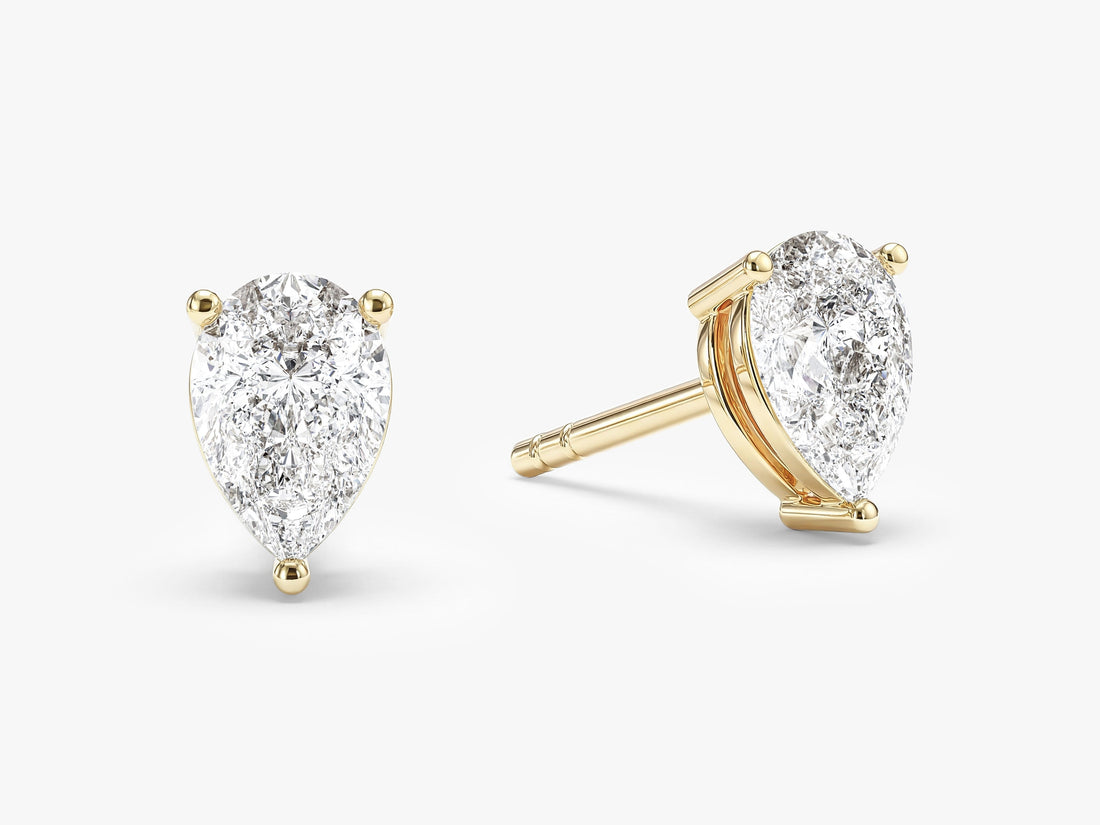 Pair of pear cut moissanite solitaire stud earrings in yellow gold