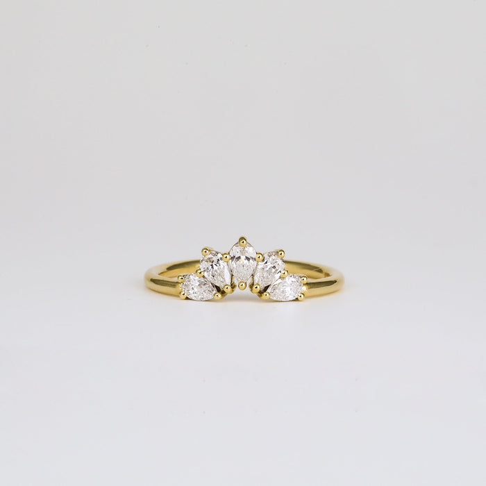 Front view of a pear moissanite five stone curved band