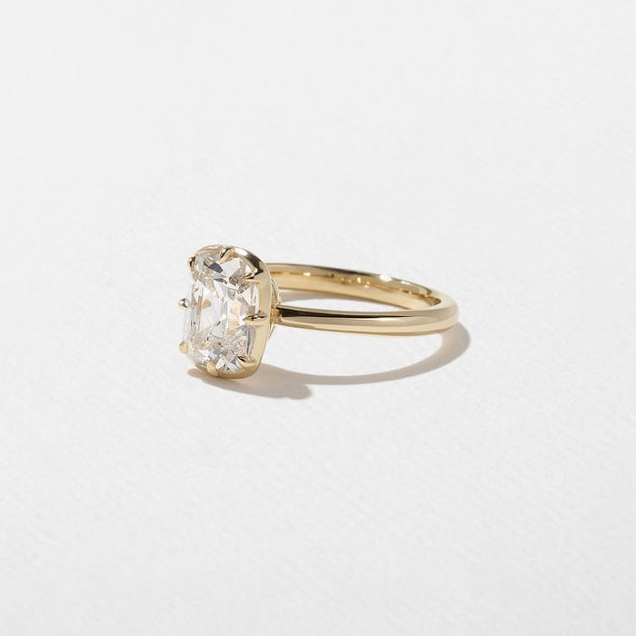 Antique cushion cut lab grown diamond solitaire engagement ring with a decorative gallery in yellow gold