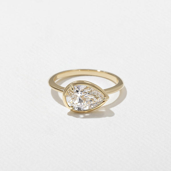 East West Pear Cut Lab Grown Diamond Bezel Set Engagement Ring on a Plain Band in Silver, 10K, 14K and 18K Gold