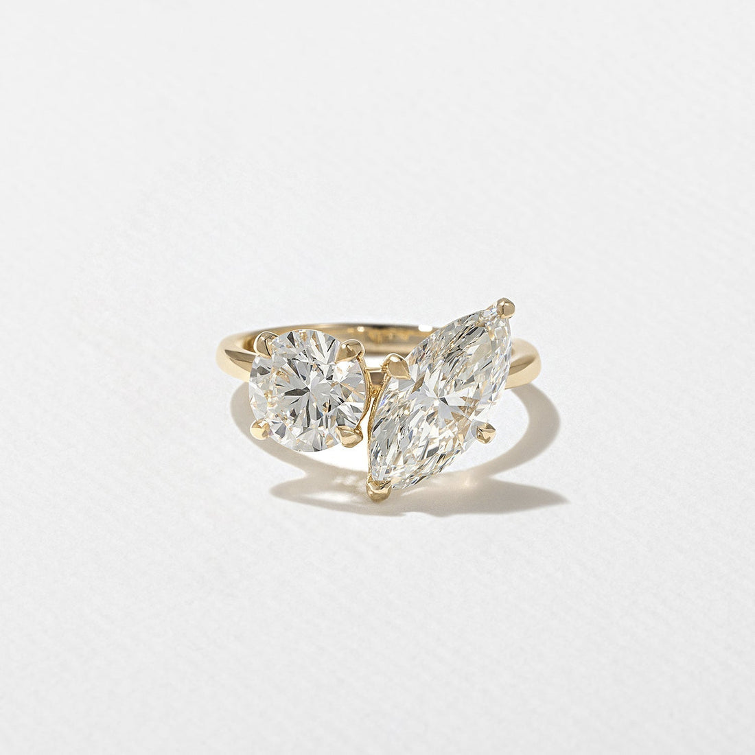 Marquise and round cut lab grown diamond toi et moi engagement ring in yellow gold