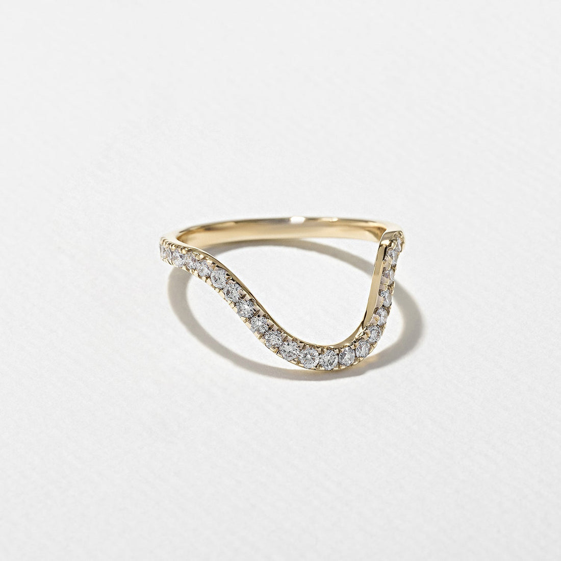 Round lab grown diamond curved half eternity wedding band in yellow gold