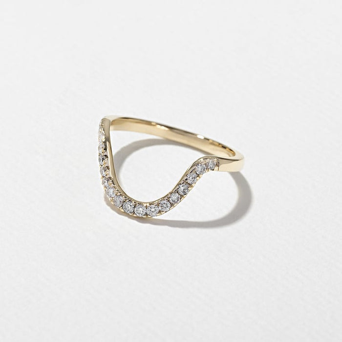 Side view of the curved half eternity moissanite band