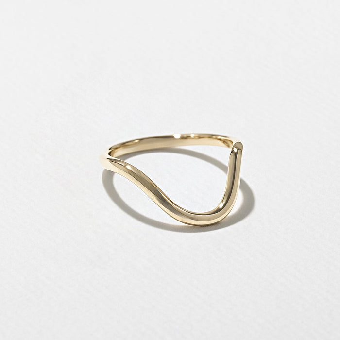 Plain curved wedding band in yellow gold
